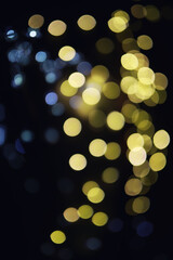 Abstract bokeh background. Golden bokeh circles on dark blue background. Layer overlay.