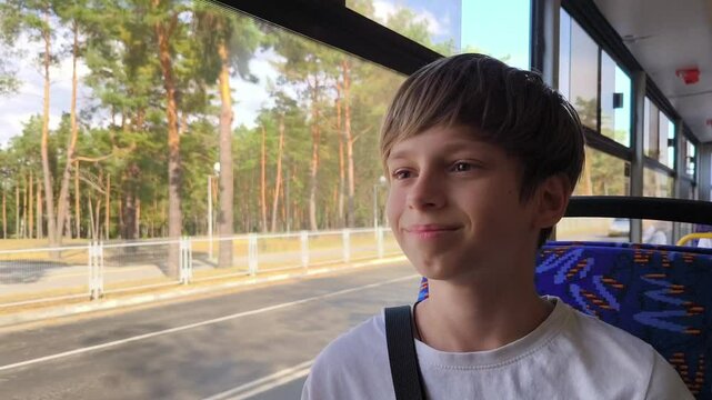 Young Boy on Bus, Lost in Thought Watching Scenery Pass, Teenager Daydreaming During Transit