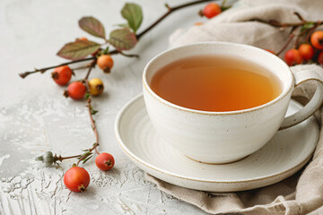 A simple, elegant cup of herbal dogrose tea, minimalits, dogrose branch with berries