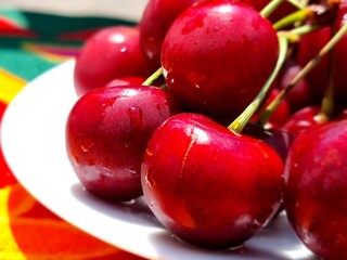 fresh red cherry on a plate

