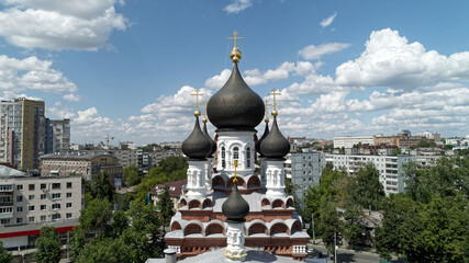 Large church with a steeple and crosses on top
