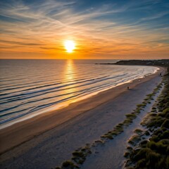 Golden sunset illuminating sandy beach and rolling waves
