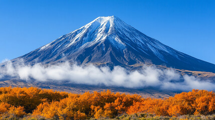 Fototapeta premium A distant mountain peak partially hidden by clouds suggesting mystery with a bright tone and modern blur, leaving empty space for a caption or interpretation 