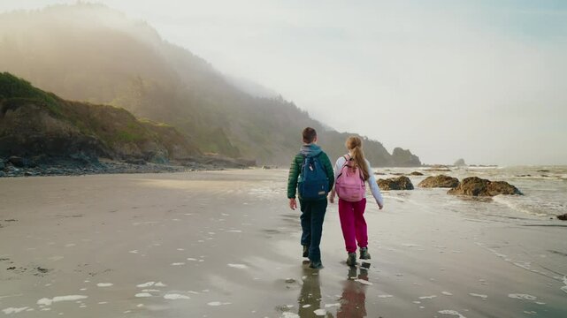 Boy and girl together outdoors on beautiful vacation beach.