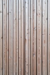 Fototapeta premium A close-up shot of a wooden fence featuring a fire hydrant