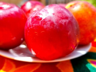 fresh plums on the plate
