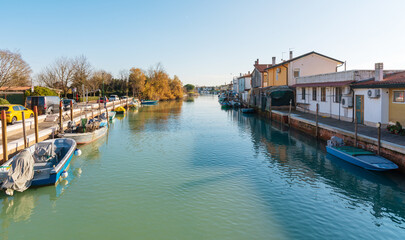Treporti canal lined with boats and houses
