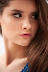 Fototapeta premium portrait of beautiful tender young natural woman in lingerie posing in white interior