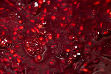 Crumpled sweet raspberries with added sugar