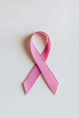 Pink breast cancer ribbon on white background