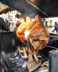 Traditional Czech Roast grilled on fire pork recipe on the Christmas market in Prague