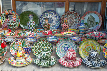 Colorful traditional painted plates and cups in bazaar in Uzbekistan, Asia