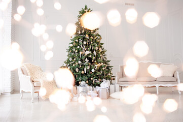 Elegant Christmas interior with a decorated tree in gold and white, wrapped gifts, a vintage beige sofa, and an armchair with a cozy knit blanket. Bright white walls create a festive, minimalism
