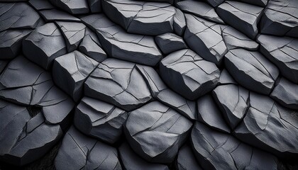 A grey rough stone slate rock texture with an abstract natural pattern, showcasing a rugged, earthy surface perfect for backgrounds and design.