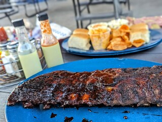 Authentic Memphis BBQ Ribs with Sides at a Restaurant Table - Southern Cuisine