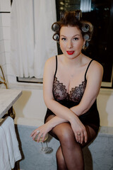 An Elegant Woman Posing in Lingerie with Vintage Hair Rollers, Exuding Timeless Charm and Style