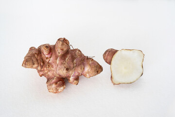 Close-up of isolated purple Jerusalem artichokes, topinambur