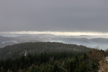 View from the Hornisgrinde mountain near Sasbach in the Black Forest into the valley, in winter...