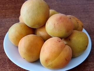 fresh apricots on a wooden background
