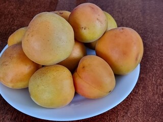 fresh ripe apricots in a bowl
