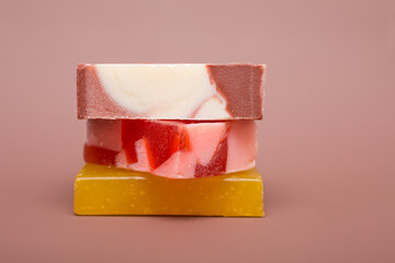  Natural multi-colored solid handmade soap a mocha mousse background. Eco-friendly natural handmade cosmetics. Natural spa products and decor for bath.Color 2025