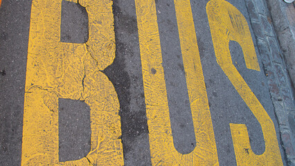 Yellow letters of the word bus