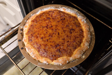 Freshly baked homemade pie with plum jam