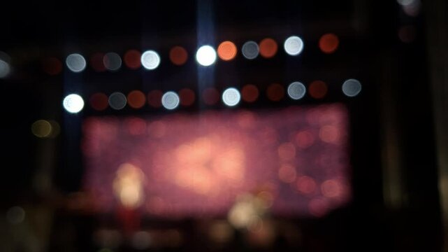 Stage lights at the music festival, colorful defocused background