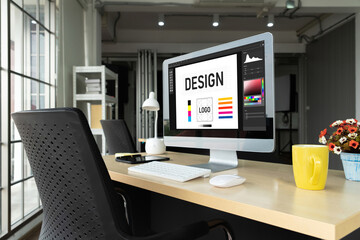 Graphic designer software for modern design of web page and commercial ads showing on the computer screen
