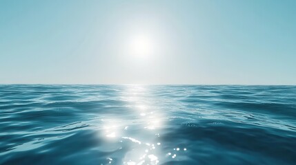 Fototapeta premium Tranquil ocean view under clear blue sky with shimmering sunlight reflection