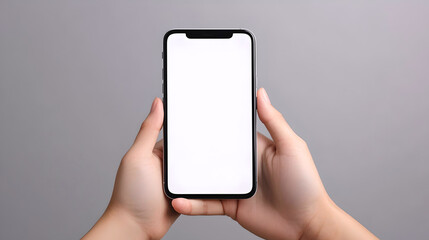 Hands holding smartphone with blank screen  
