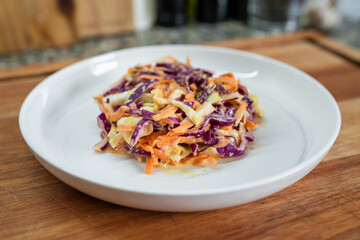 Classic Coleslaw salad on a white plate. Concept of healthy eating.