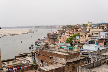 Fototapeta premium Aerial view over Varanasi old town and Ganges river in Uttar Pradesh, India
