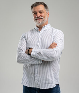 portrait of confident businessman. Entrepreneur in blue shirt, mature age man standing, isolated on white background