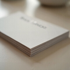 Stacked blank cards on table, minimalistic design inspiration