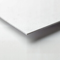 Close-up view of textured white paper, artistic minimalism