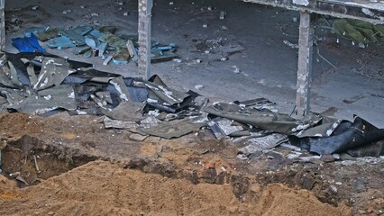 Construction Material Waste Debris and Roofing Felt Sheets at Building Demolition Site