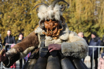 The Surva masquerade games festival in Sofia, Bulgaria. People called Kukeri parade in masks and...