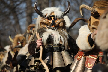 The Surva masquerade games festival in Sofia, Bulgaria. People called Kukeri parade in masks and...