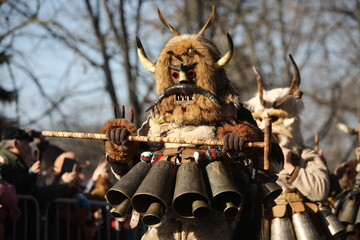 The Surva masquerade games festival in Sofia, Bulgaria. People called Kukeri parade in masks and...