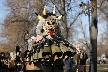 The Surva masquerade games festival in Sofia, Bulgaria. People called Kukeri parade in masks and ritual costumes, perform ritual dances to drive away evil spirits in Sofia, Bulgaria