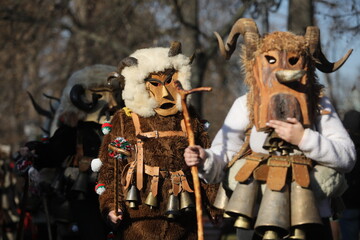 The Surva masquerade games festival in Sofia, Bulgaria. People called Kukeri parade in masks and...