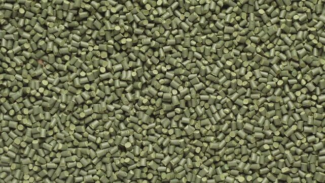 Green polymer dye in granules, background texture
