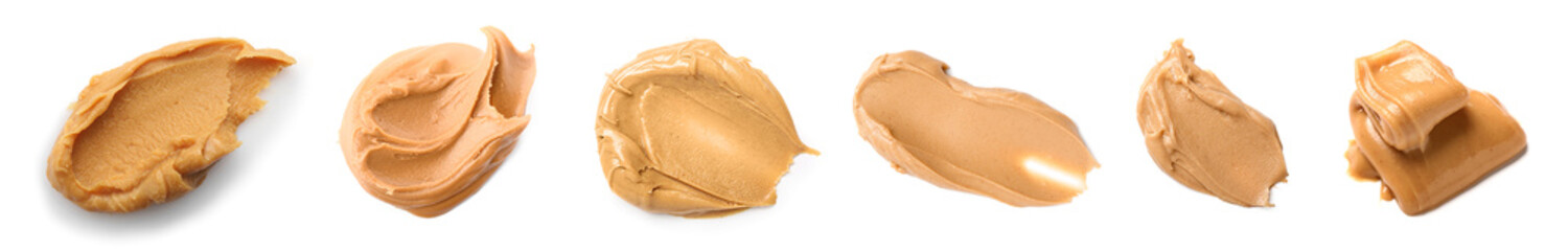 Many strokes of peanut butter on white background, top view