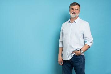 Portrait of happy casual older man smiling, Mid adult, mature age male with gray hair, Isolated on...