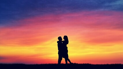 silhouette of a couple embracing together