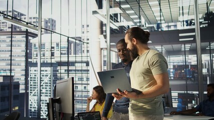 Programmer and colleague conducting experiments and tests to optimize machine learning models for...