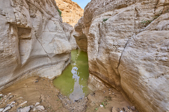 A nature pool created by flood water during heavy rains in wadi Upper Darga in the nature reserve Matzok HaEtekim, Judaean Desert. The most spectacular view the nature reserve offers. Turquoise water.