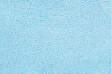 Texture of genuine leather or artificial synthetic leatherette pastel blue color. Skin structure close up, macro, Background, wallpaper, backdrop with copy space.