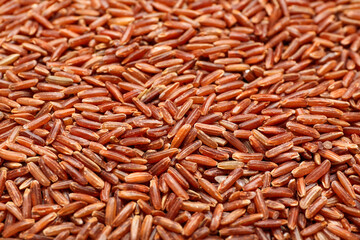 Raw brown rice as background, closeup